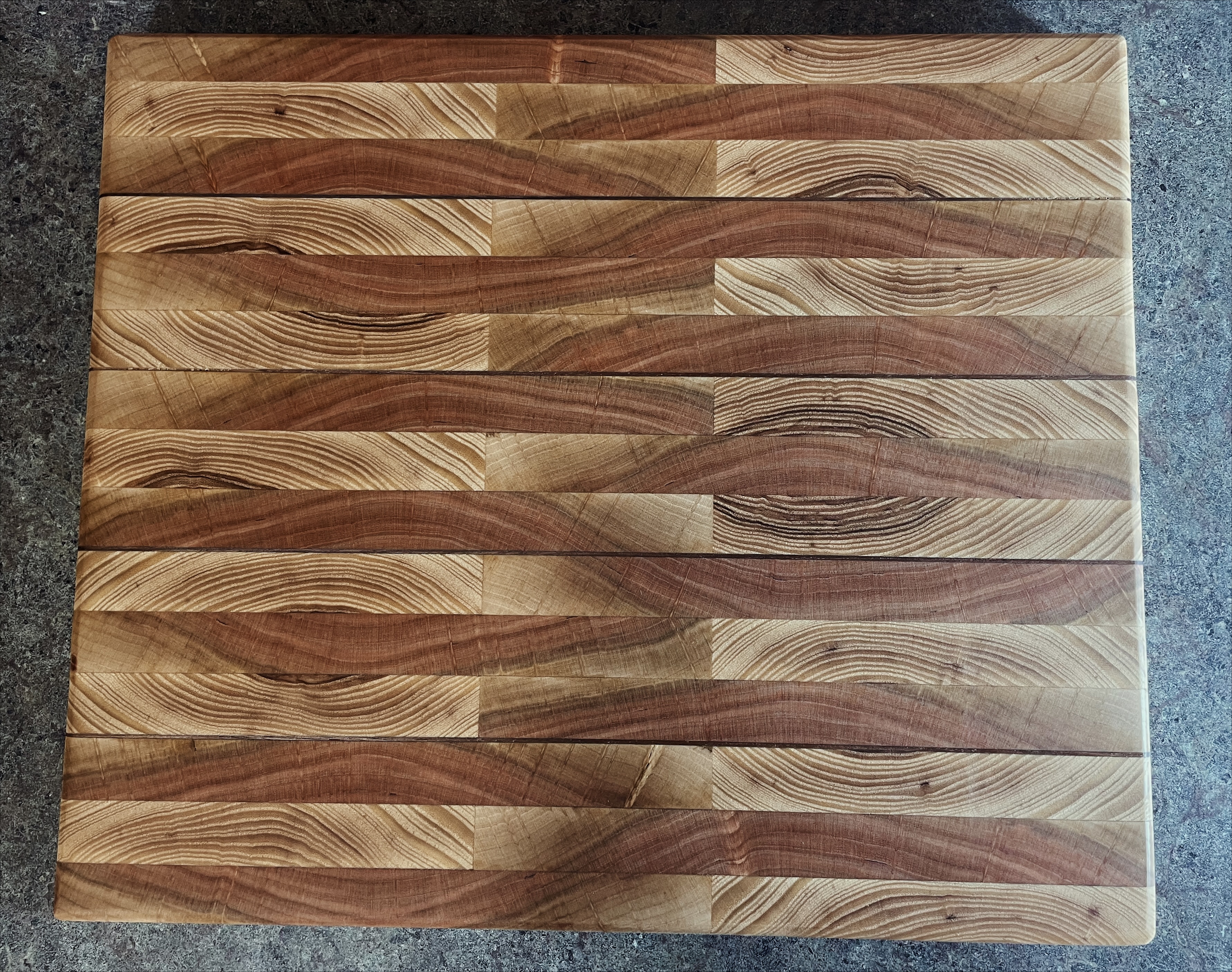 Handcrafted striped hardwood cutting board